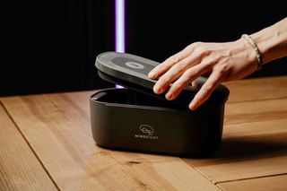 Remote worker using a phone lock box for productivity