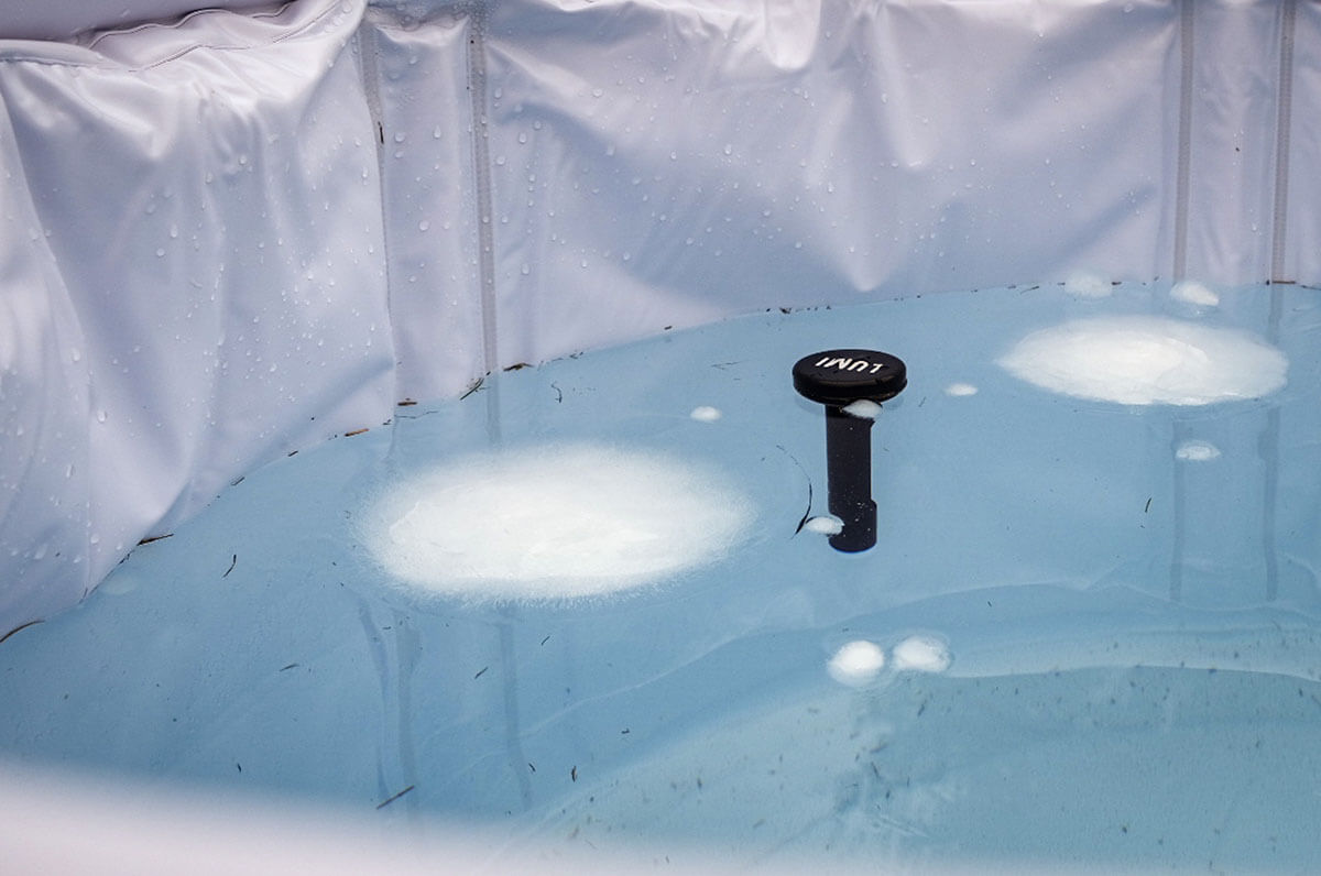 Close up of blocks of ice and a floating thermoter