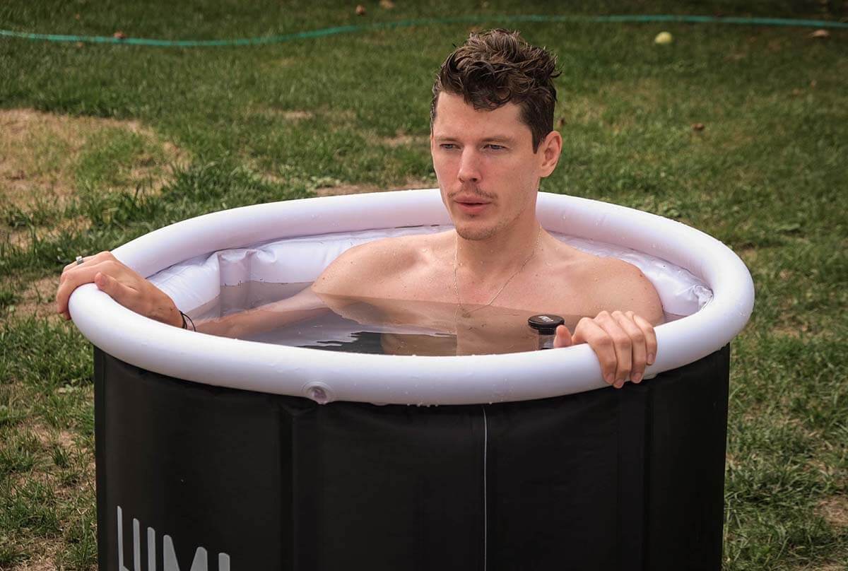 Man relaxing in portable ice bath