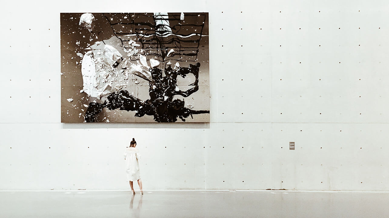 a woman getting inspiration at an art gallery