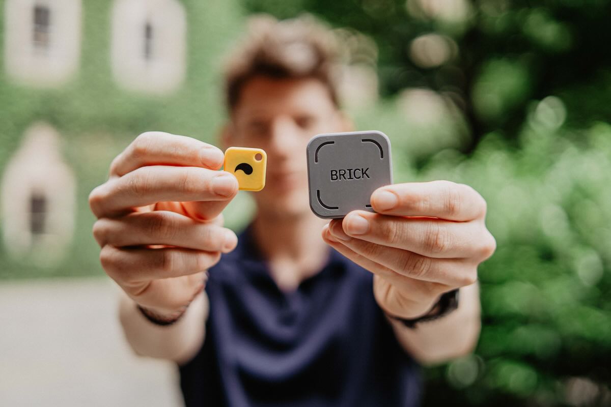 Man holding both Brick and Unpluq